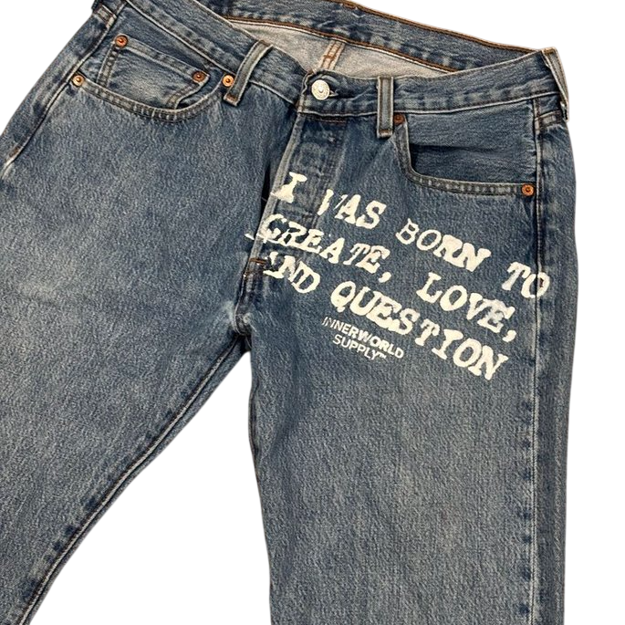 Reconstructed vintage Levi's denim with Born To Create print on the front thigh